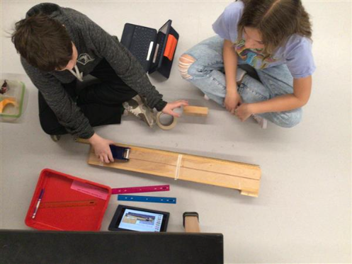 students work on science project